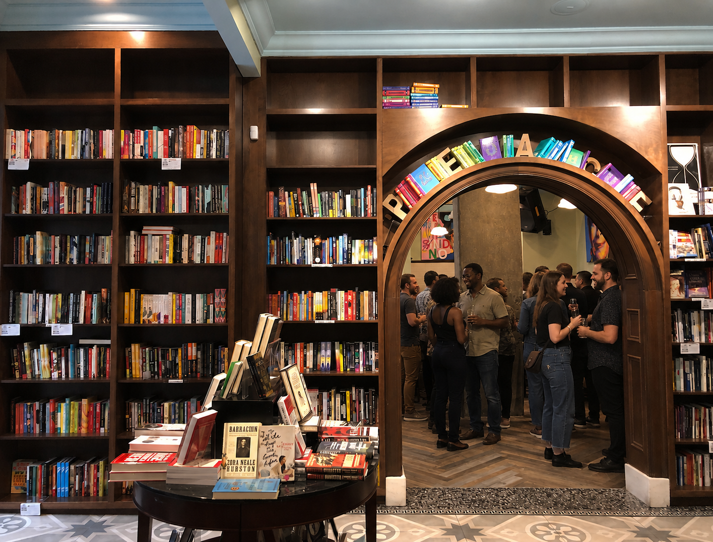 Guests gathering in the bookstore event space at Busboys & Poets
