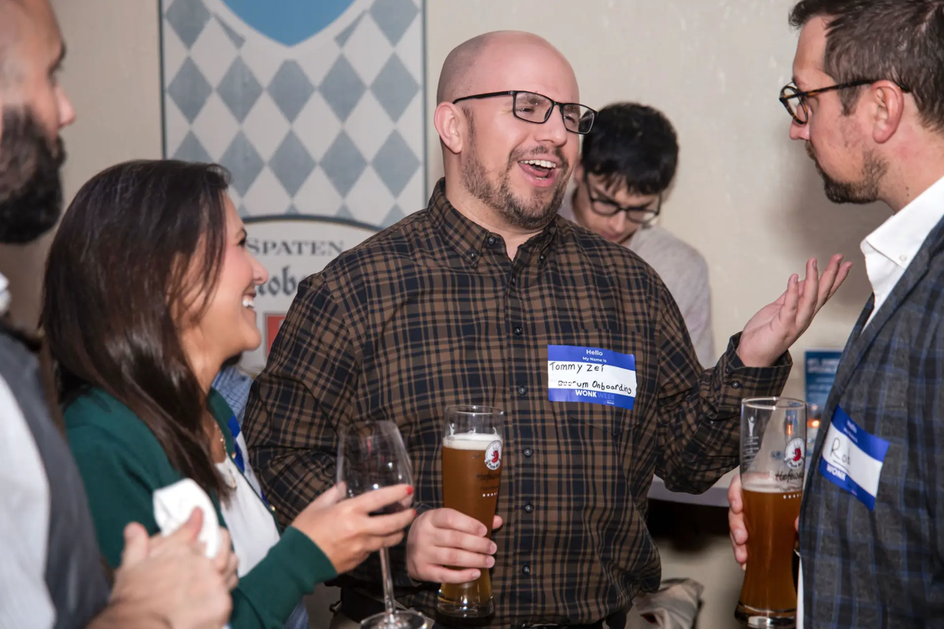 Wonk Week attendees toasting steins of beer at Wonktoberfest